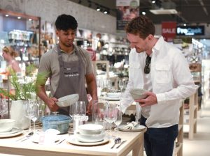 ProCook Colleague serving Customer ProCook commits to Real Living Wage